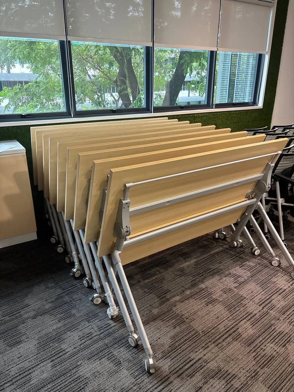 Recovered foldable office tables prepared for refurbishment and resale