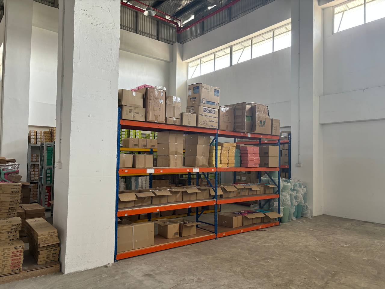 Organized warehouse shelving with various boxes in CPL Services Pte Ltd storage facility